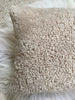 Side view of tan shearling sheepskin pillow