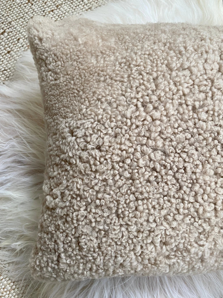 Top-view of ivory shearling sheepskin pillow