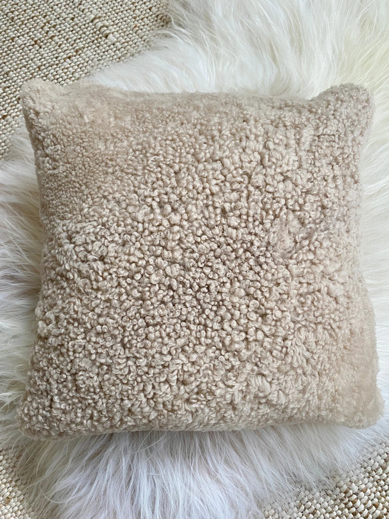 Top view of ivory shearling sheepskin pillow