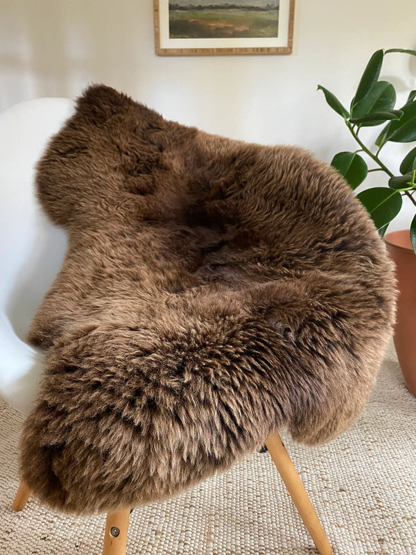 classic light brown sheepskin throw on a chair 