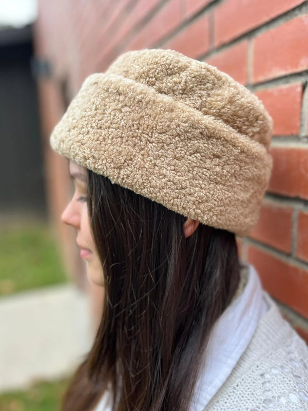 Woman wearing cortina beanie sheepskin bucket hat