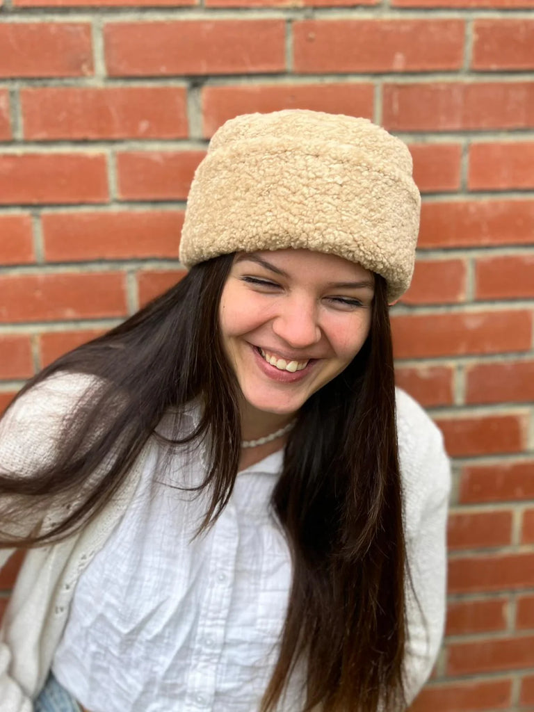 Person wearing a cortina beanie sheepskin bucket hat