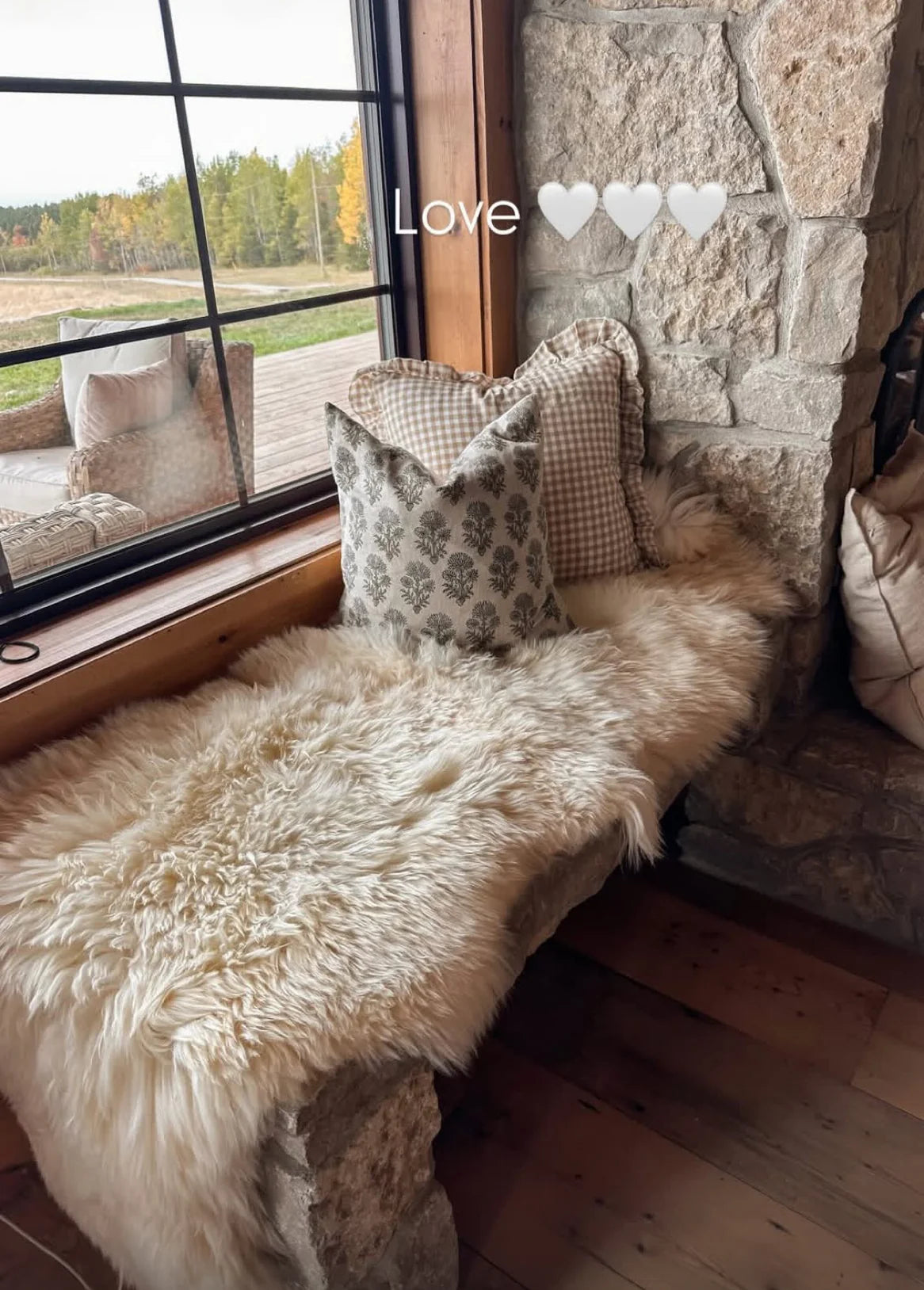 Cozy corner with pillows and double sheepskin in white