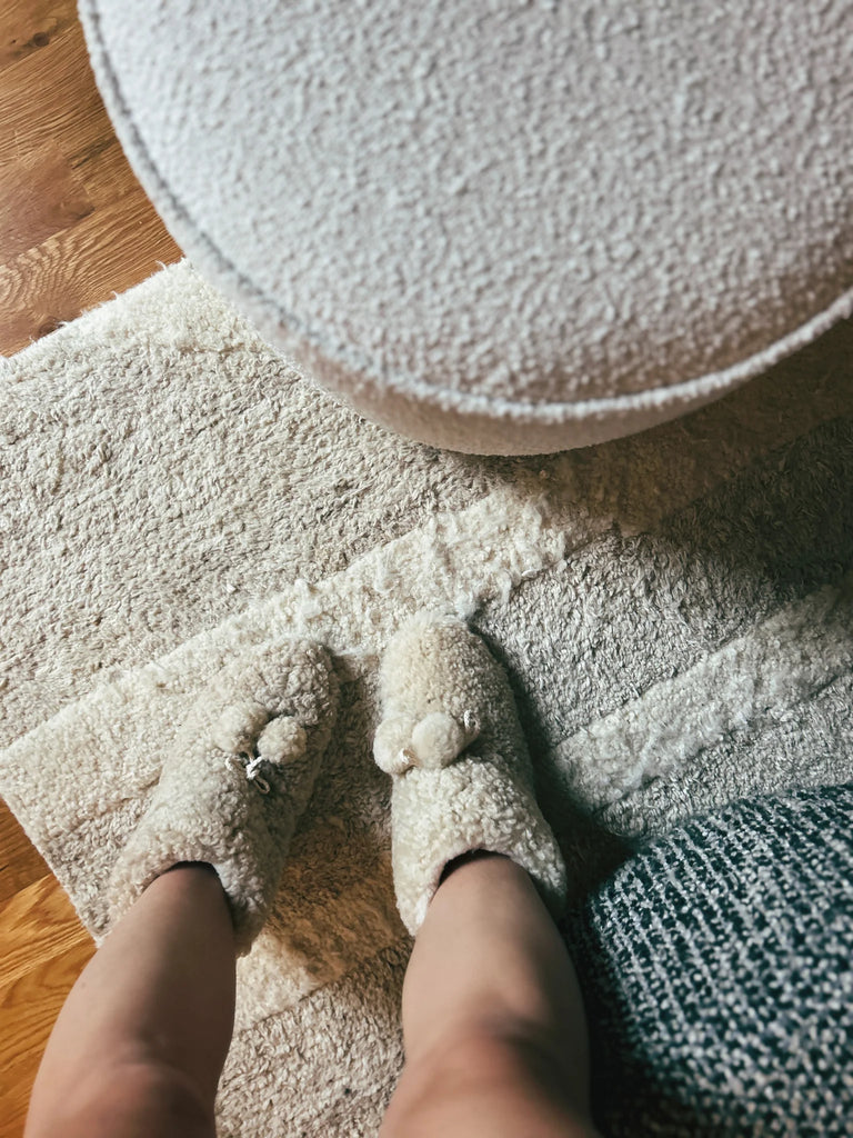 Person wearing extra warm sheepskin booties