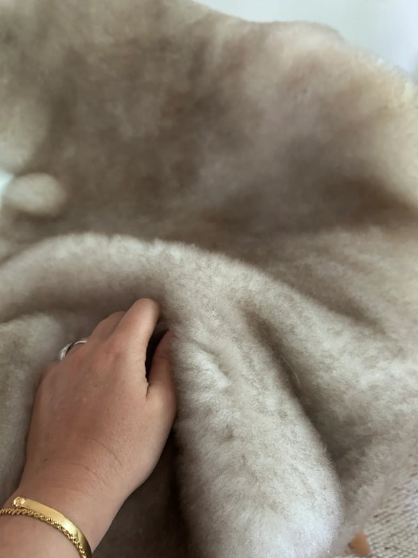 Close-up of greyish brown shortfur sheepskin