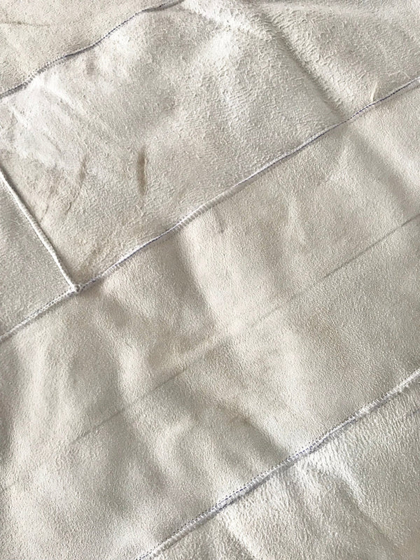 Close-up of ivory plush sheepskin blanket inside