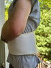 Person wearing medical grade sheepskin kidney warmer and waist belt