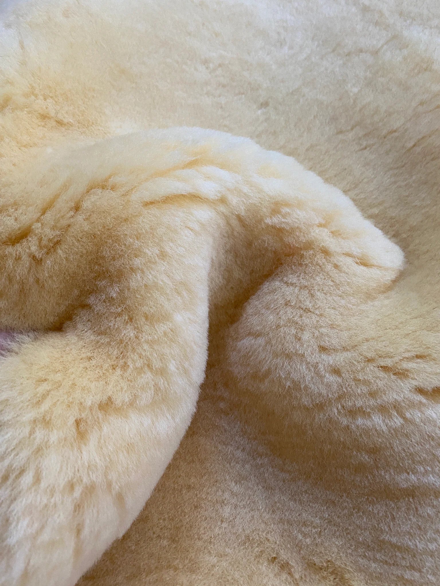 Close-up of medical relugan nursery sheepskin fabric with a soft texture