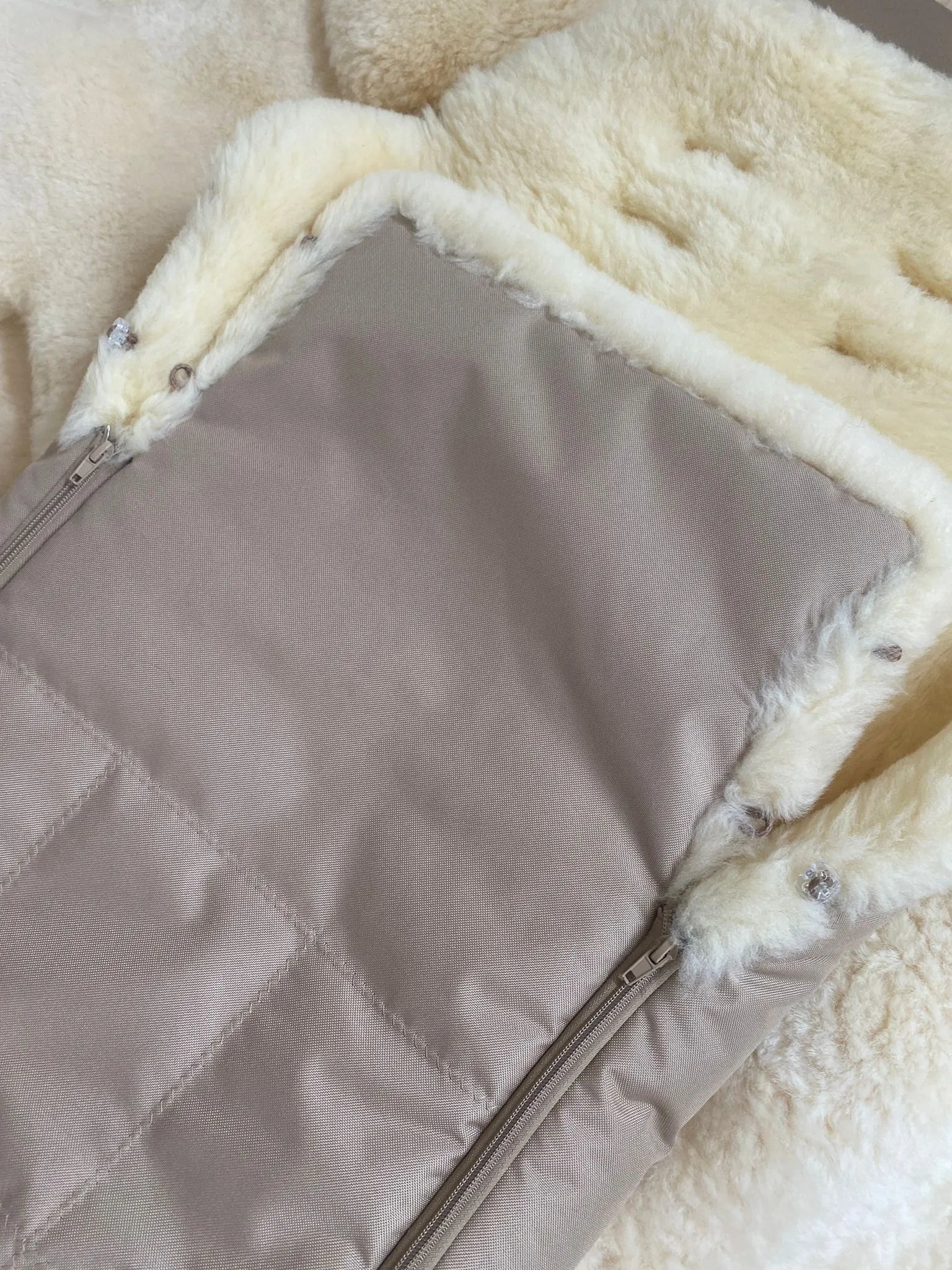 Close-up of a quilted fabric OF medical sheepskin baby toddler sleeping bag