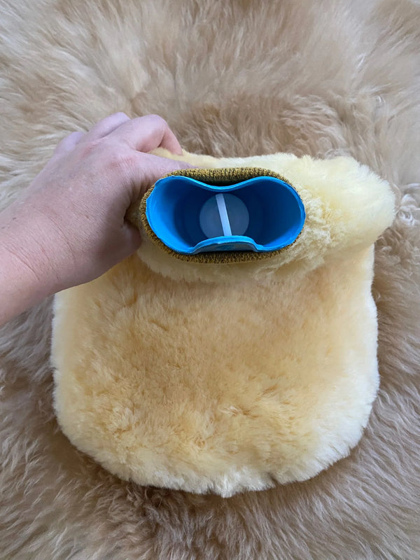 top view of pain and anxiety relief sheepskin hot bottle