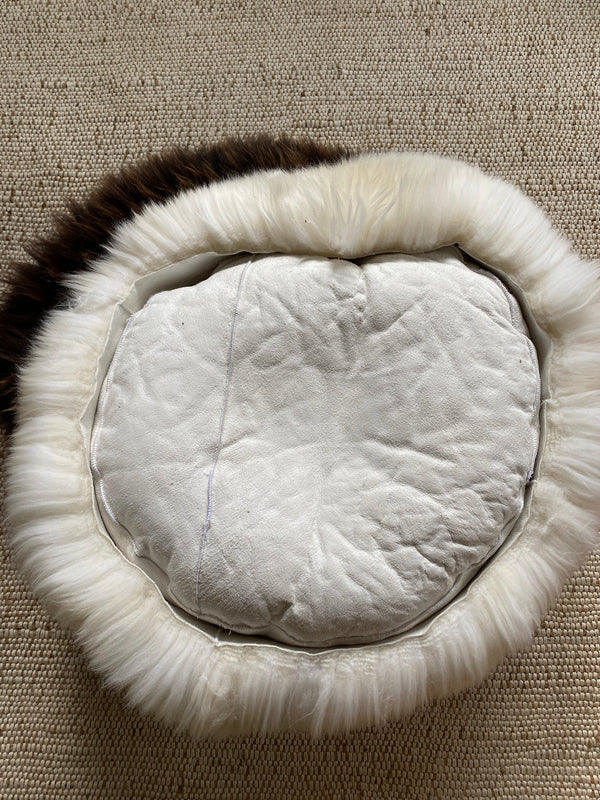 Rear view of plush ivory animal snug
