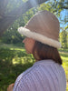 Person wearing santa-fe sheepskin bucket hat