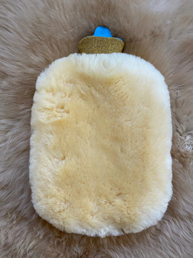 Close-up of sheepskin hot water bottle warmer