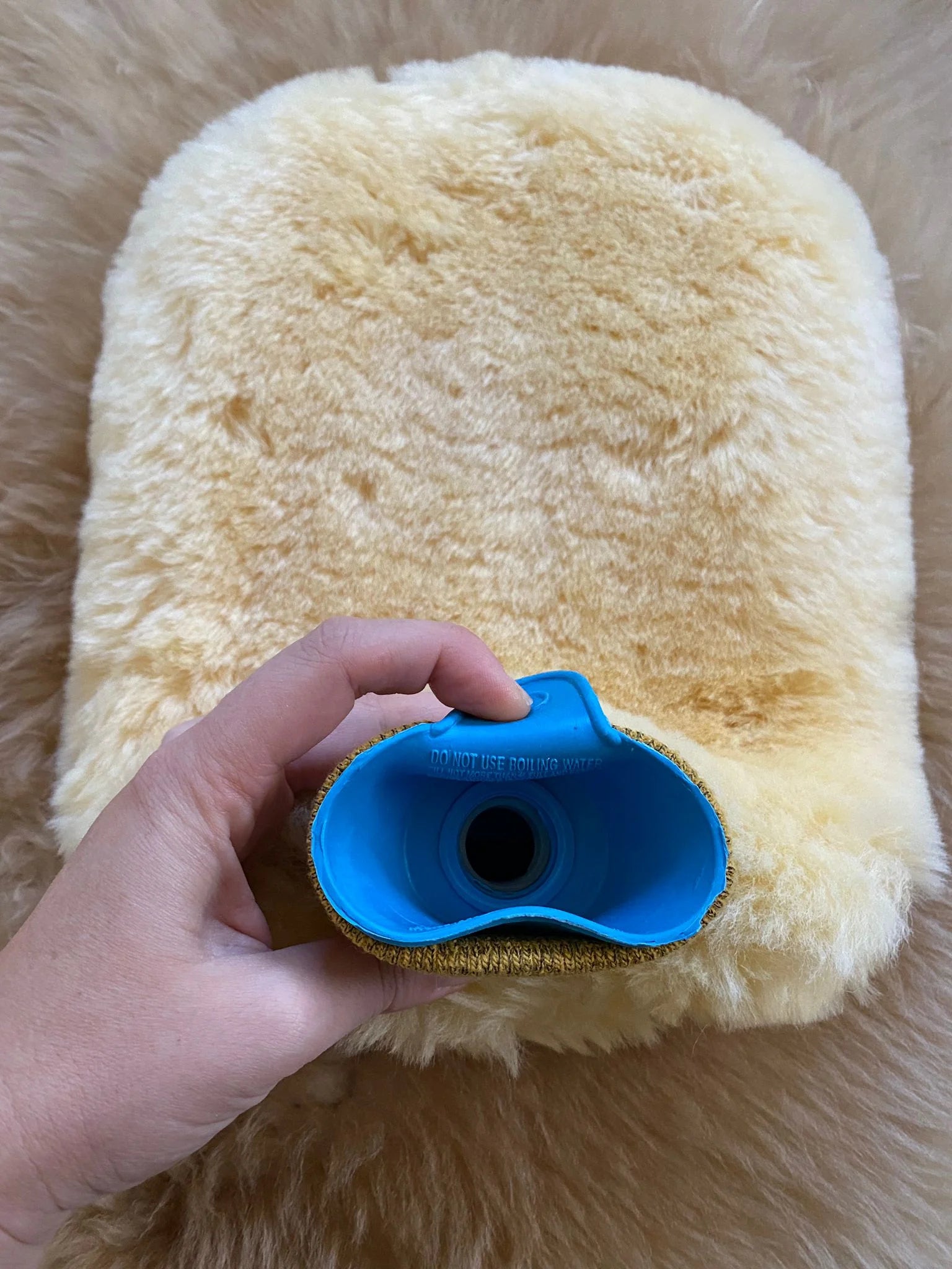 Cap-view of sheepskin hot water bottle warmer