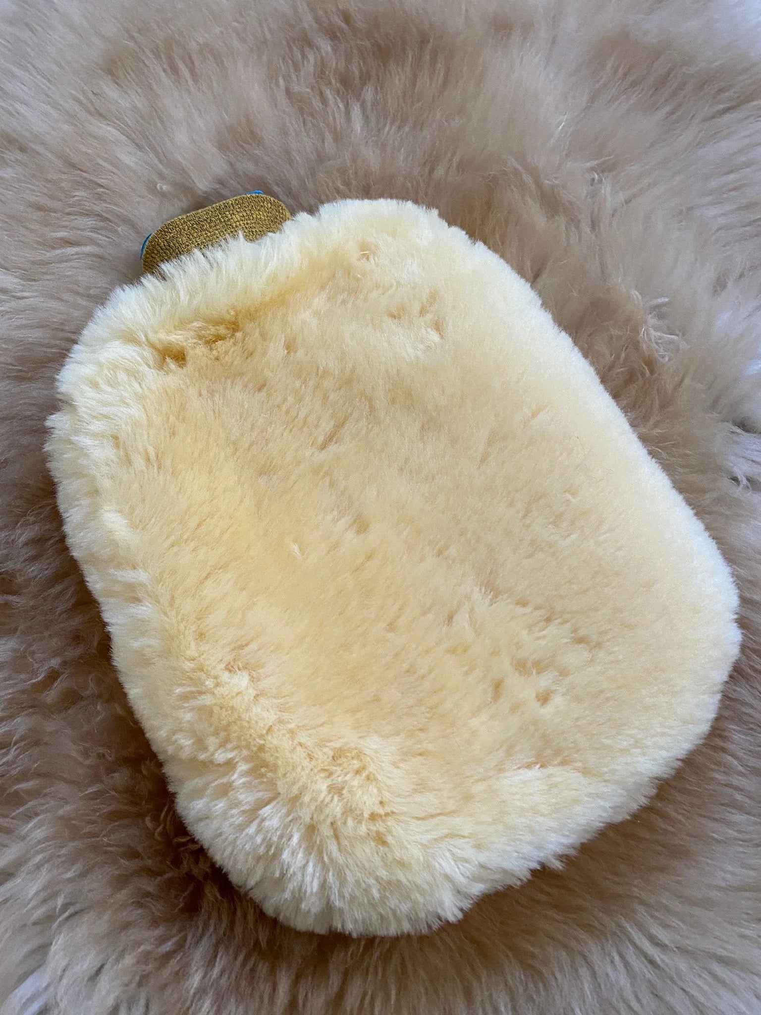 Top-view of sheepskin hot water bottle warmer