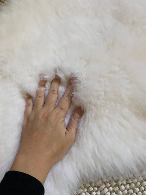 Texture of small white nursery pelt