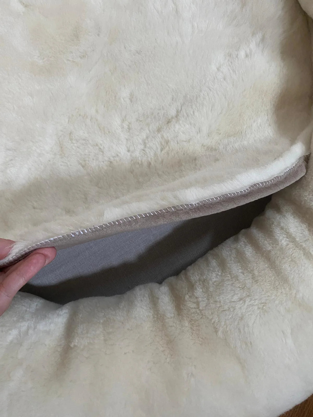 Inside-view of snugly short fur sheepskin dog bed
