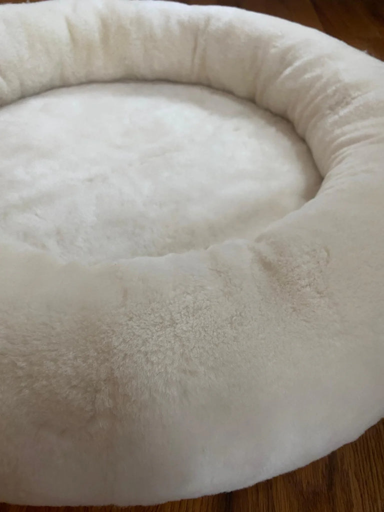 Close-up of snugly short fur sheepskin dog bed