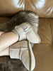 Close-up of terra slipper sheepskin minimalist footwear for kids with tan fur