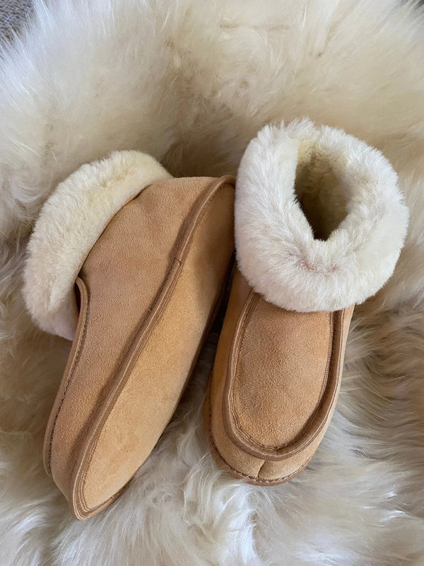 Pair of terra slipper sheepskin minimalist footwear tan