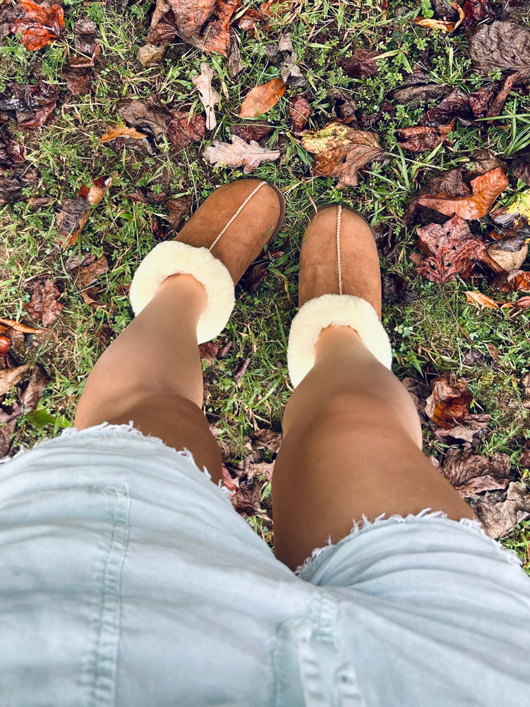 Feet wearing the cottage slipper