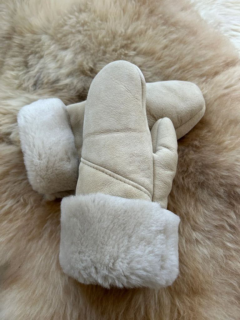 Pair of the haven sheepskin mitten in cream