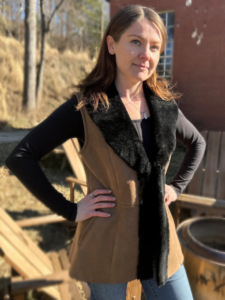 Woman standing in the maven vest